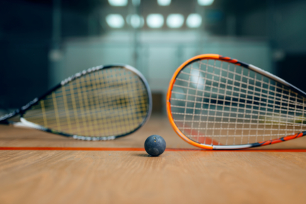 two squash rackets and ball game