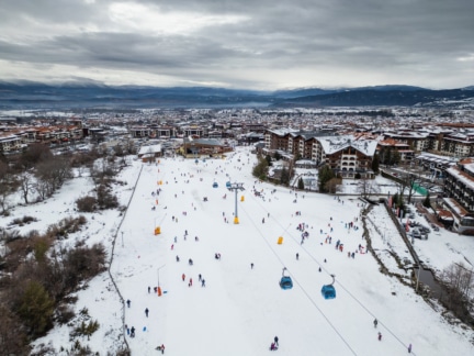 skiers enjoy a snowy day at the