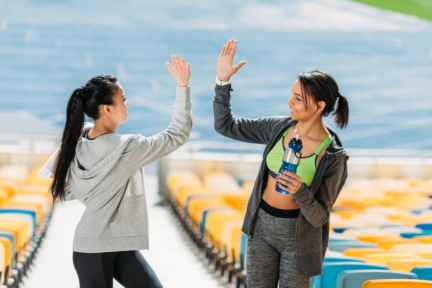 two young sportswomen with sport