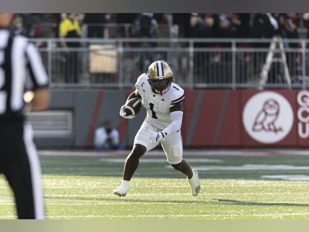 college football player in action stadium