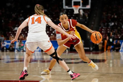 college basketball player in game action