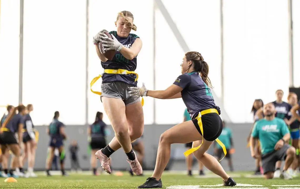 women's college flag football action