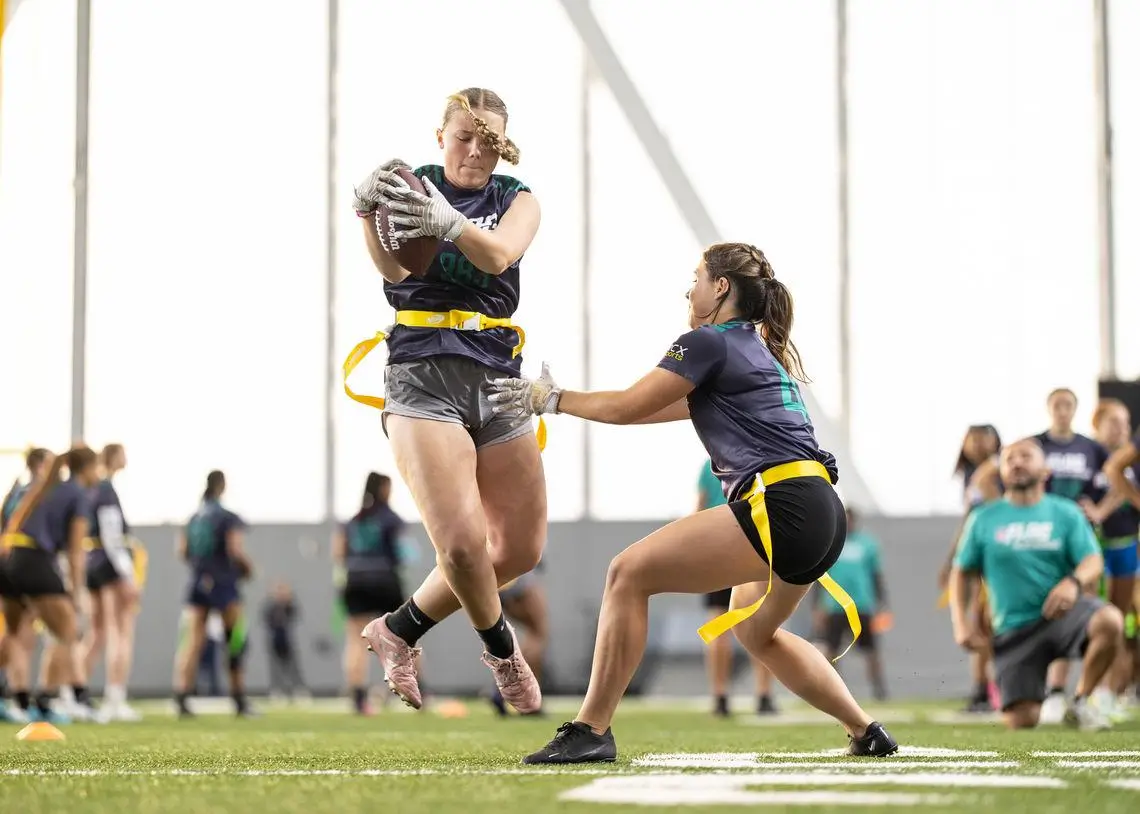 women's college flag football action