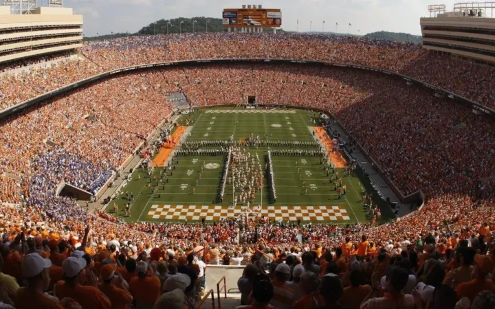 College athletes competing in a stadium during a game